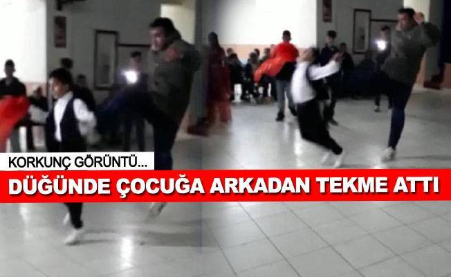 Düğünde oynayan çocuğa tekme attı