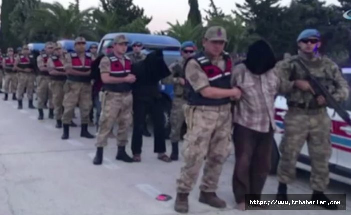 MİT, iki askerimizi şehit eden 9 teröristin başlarına toba takarak Türkiye'ye getirdi! Video Haber izle